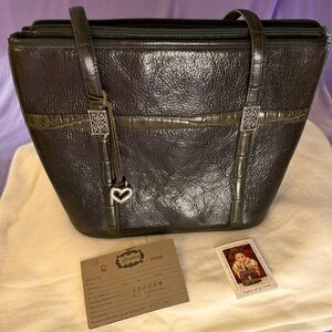 New Brighton satchel with plenty of space, it is dark green with brown trim.